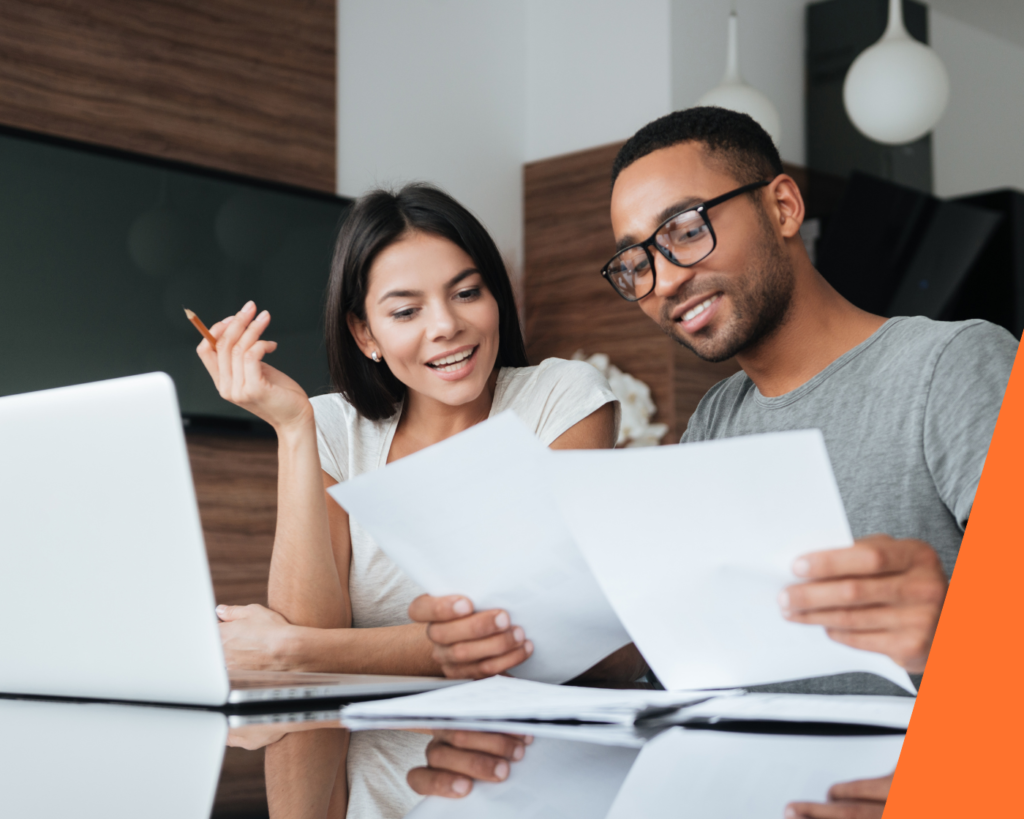 Homeowners reviewing paperwork to remortgage Help to Buy equity loan in 2026.