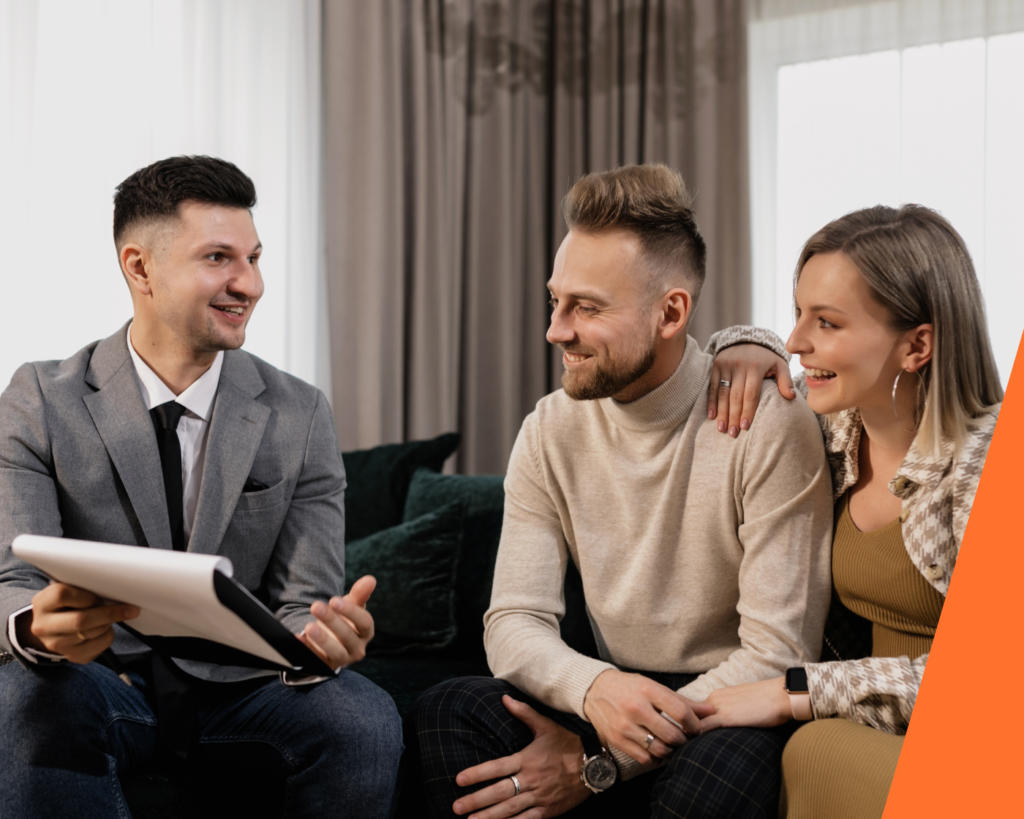 Young couple discussing first time buyer mortgage advice with a friendly mortgage advisor in a bright, modern office.
